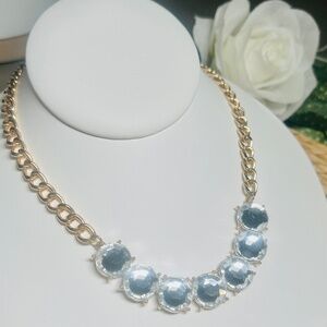 Clear sparkling, faceted 5/8” stones on a beautiful gold plated link chain.